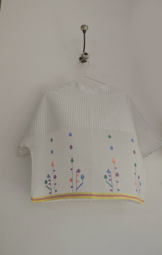 Spring Bloom Top ensemble by INDIGO DREAMS featuring a floral-patterned blouse with ruffled details and pastel colors.