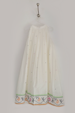 Elegant Tamara Dress ensemble by INDIGO DREAMS featuring flowing fabric and intricate detailing on a model.