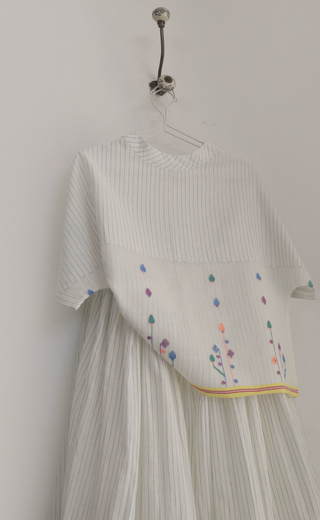 Spring Bloom Top ensemble by INDIGO DREAMS featuring a floral-patterned blouse with a relaxed fit and vibrant spring colors.