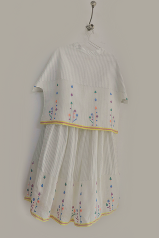 INDIGO DREAMS spring bloom skirt and top ensemble featuring a floral pattern and lightweight fabric, perfect for warm weather.