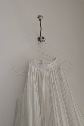 Spring Bloom Dress ensemble by INDIGO DREAMS featuring a floral patterned fabric and a flowing, elegant design.